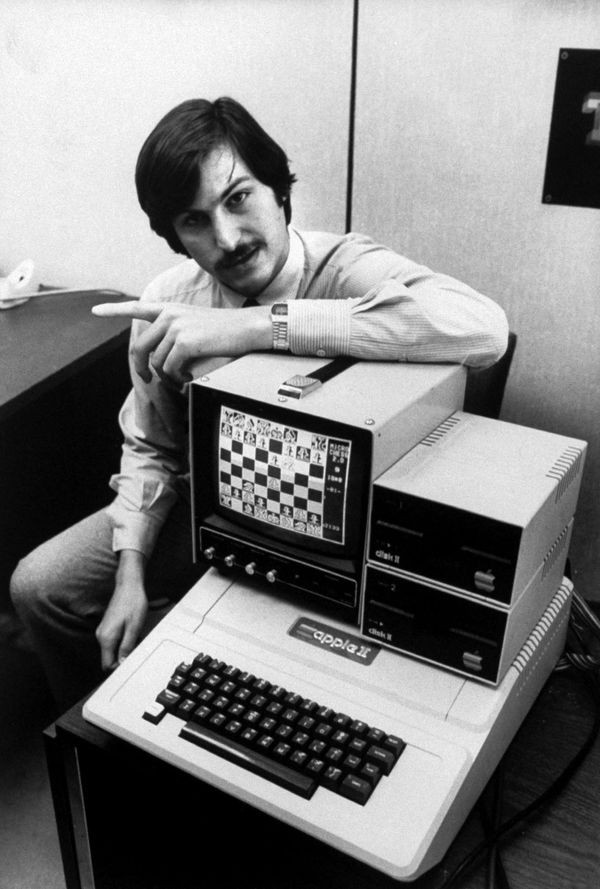 A picture of steve jobs with Apple computer II in 1971